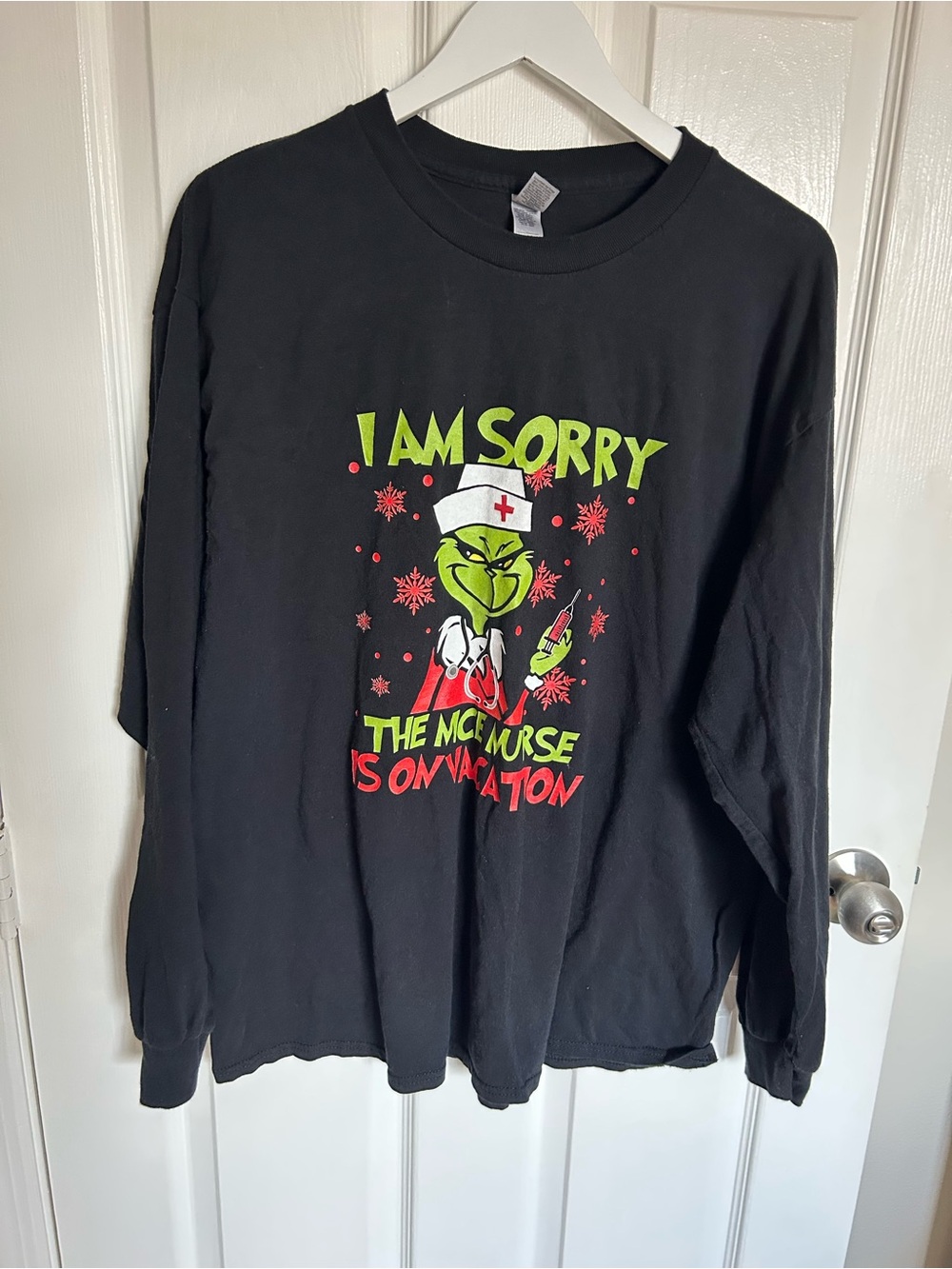 Gildan Black Long-Sleeve Tee with Green Grinch Nurse Graphic